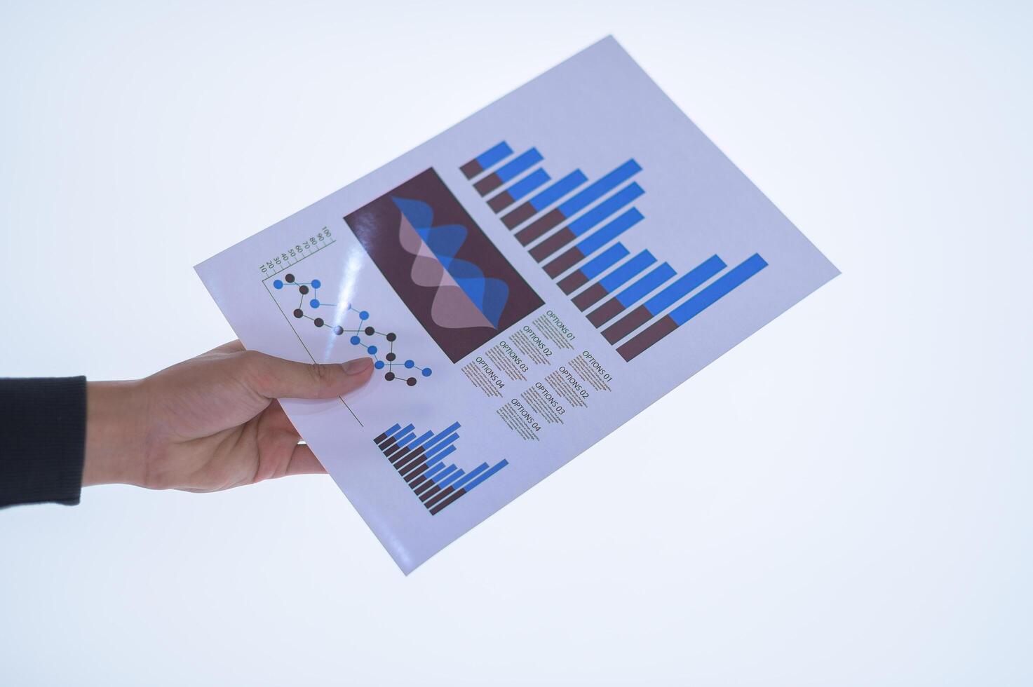 Hand holding documents photo