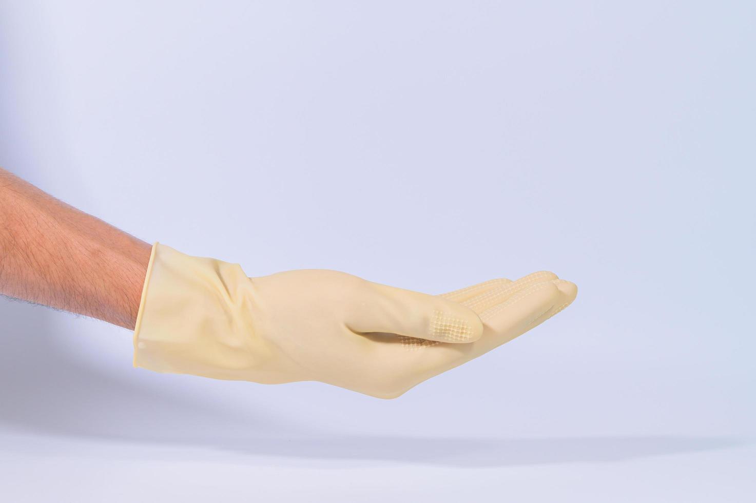 Hand in rubber gloves photo