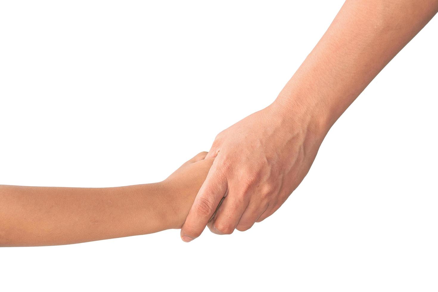 Adult holding child's hand isolated on background photo