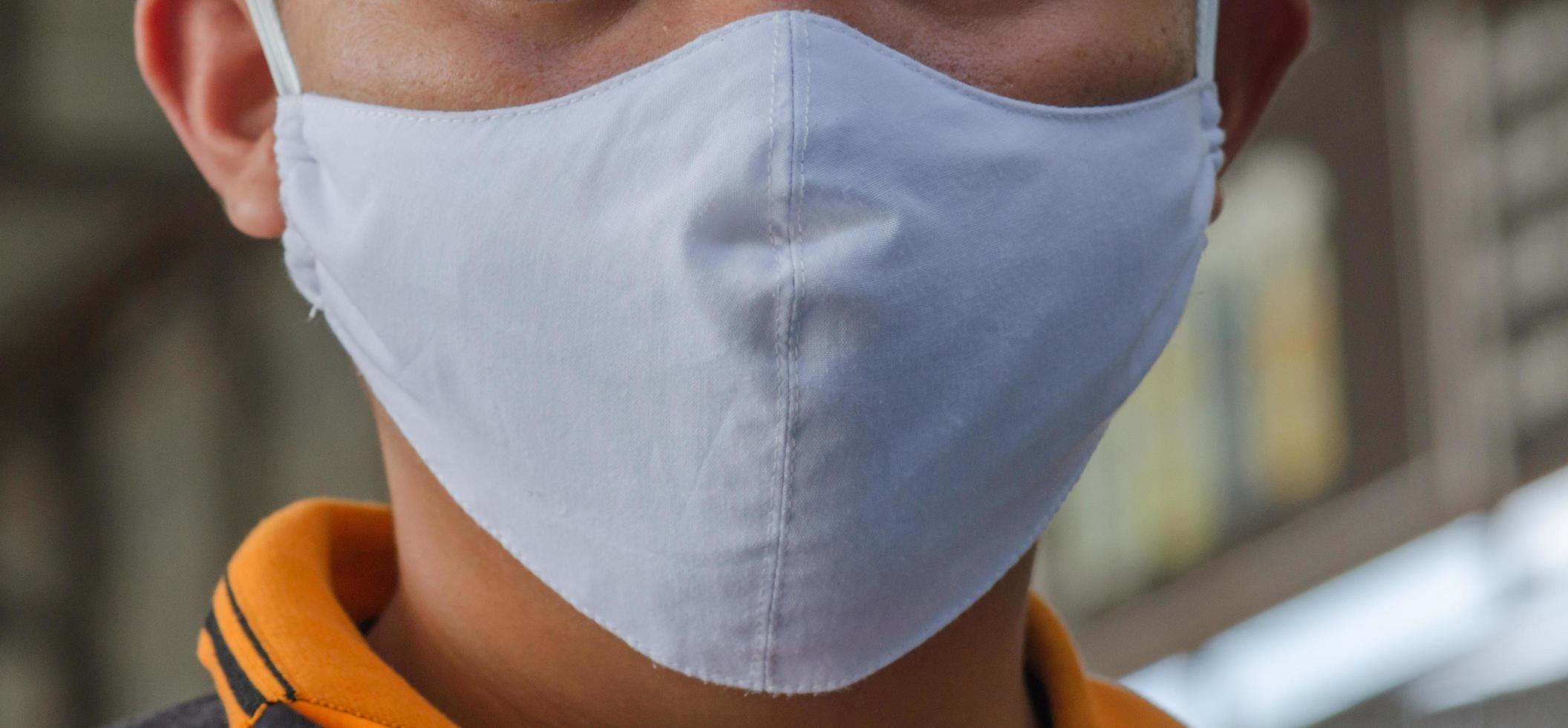 Close-up of person wearing mask photo