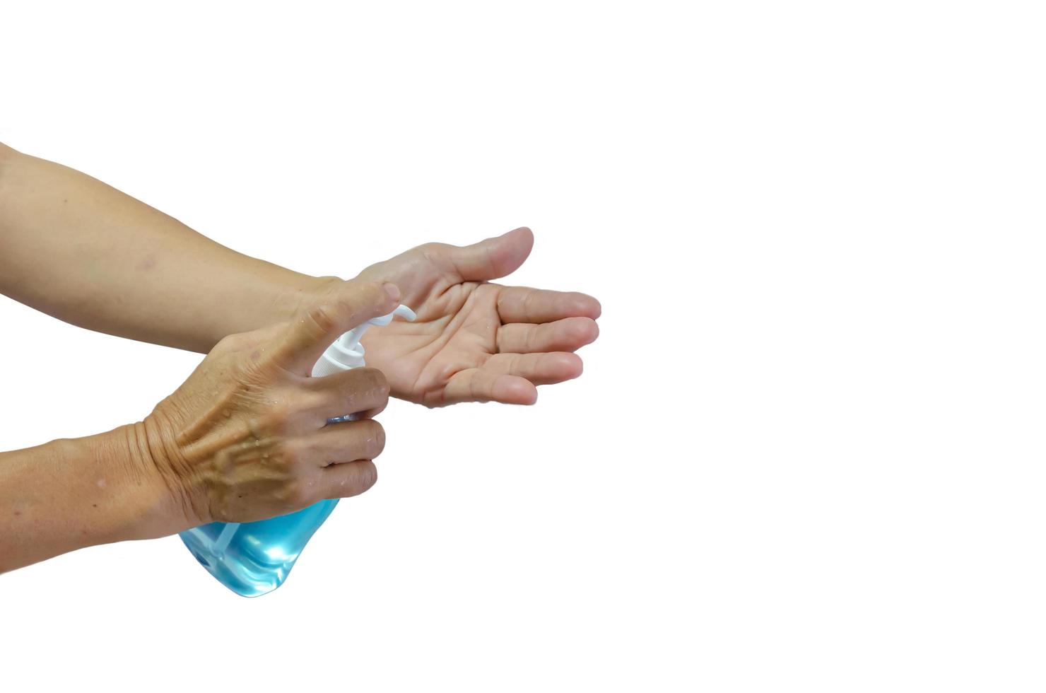 Close-up of person using hand sanitizer photo