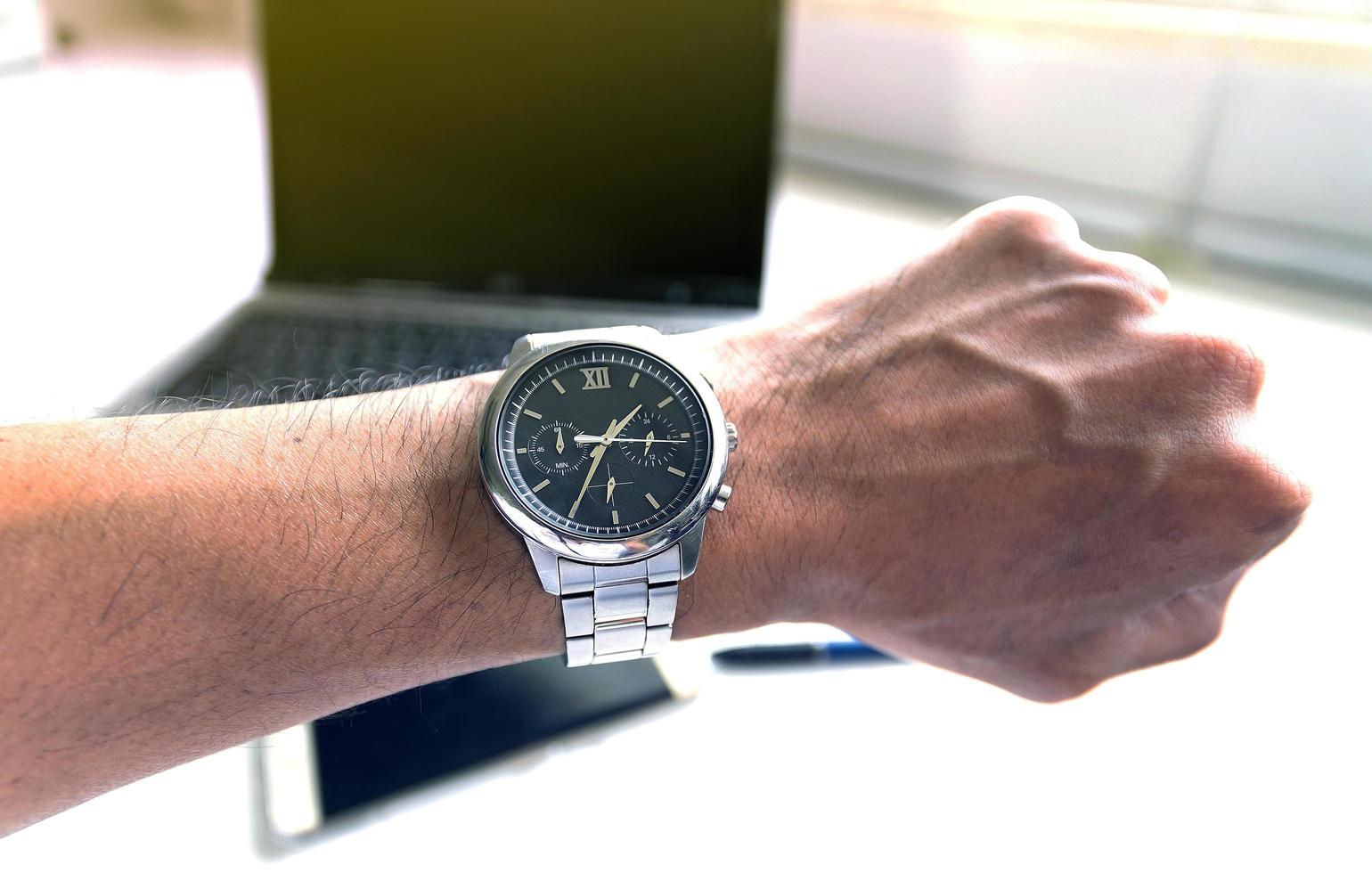 Businessman looking at his watch photo