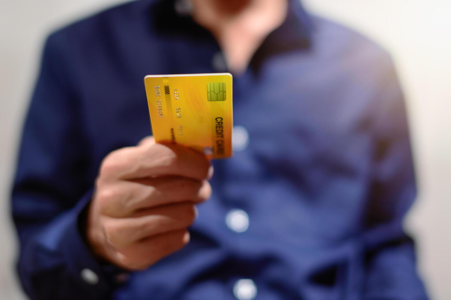 Businessman with credit card photo