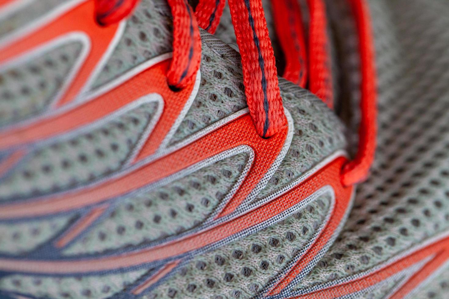 Close-up of grey and red running shoes photo