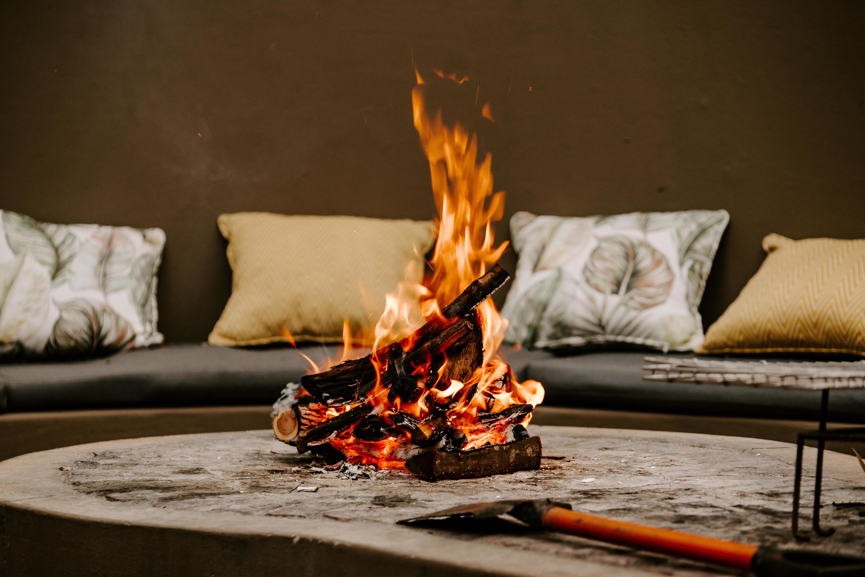 Fire burning in fire pit with an axe 1433136 Stock Photo at Vecteezy
