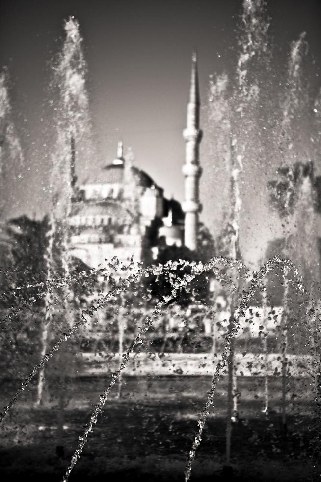 Fountain with mosque in the background in Istanbul, Turkey photo
