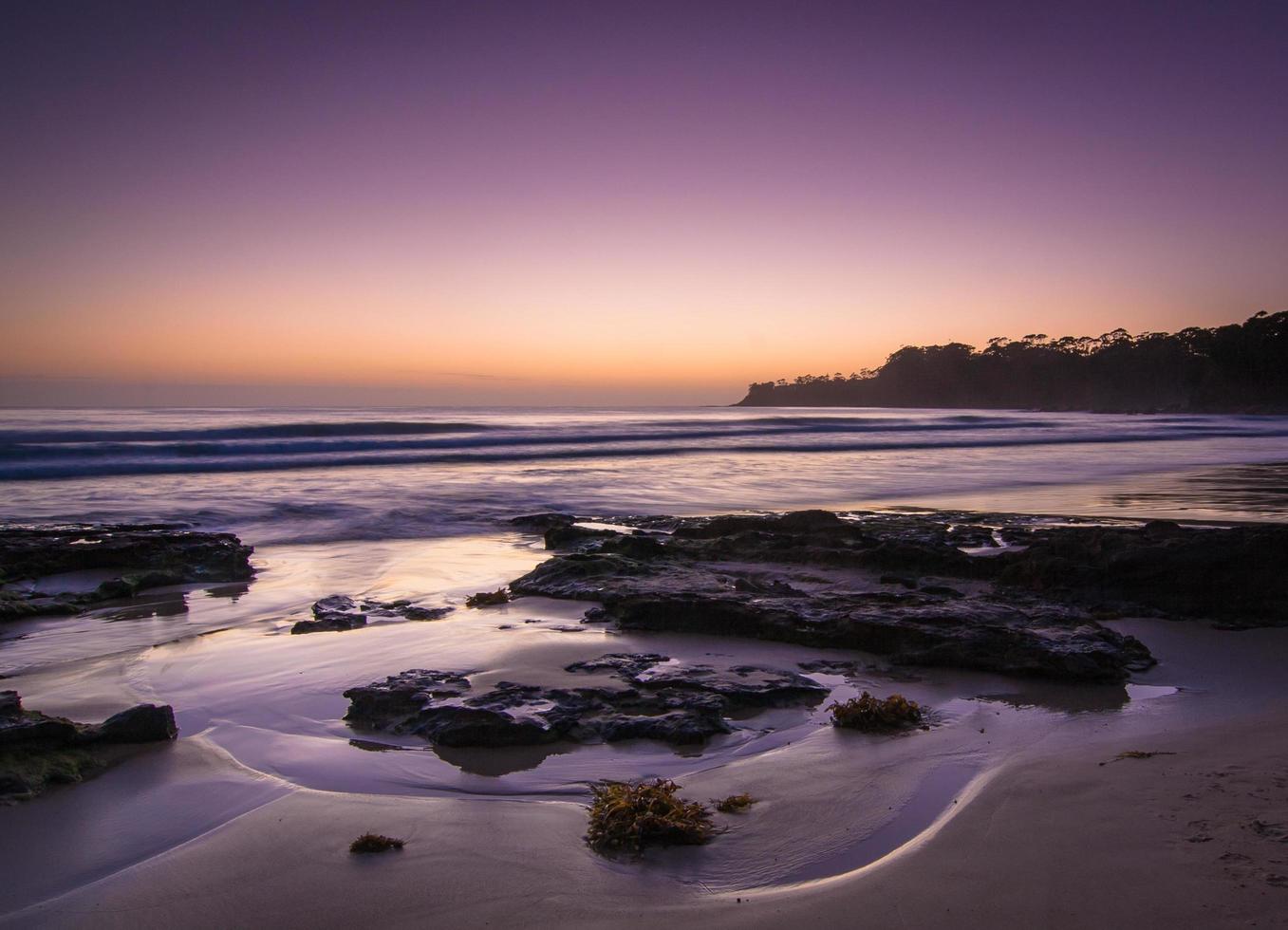 Seashore at sunset photo