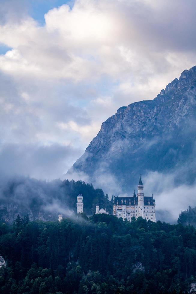 Bavaria, Germany, 2020 - View of the Neuschwanstein Castle surrounded by fog photo