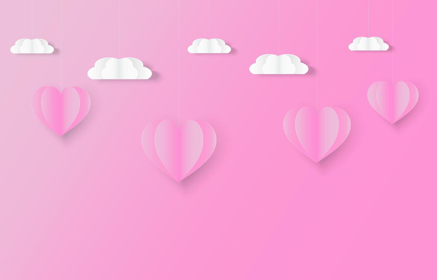 corazones rosados y nubes en estilo de corte de papel vector