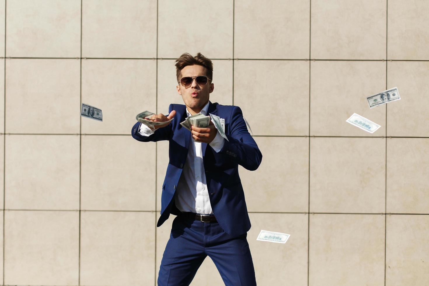 Man throwing money on the street photo