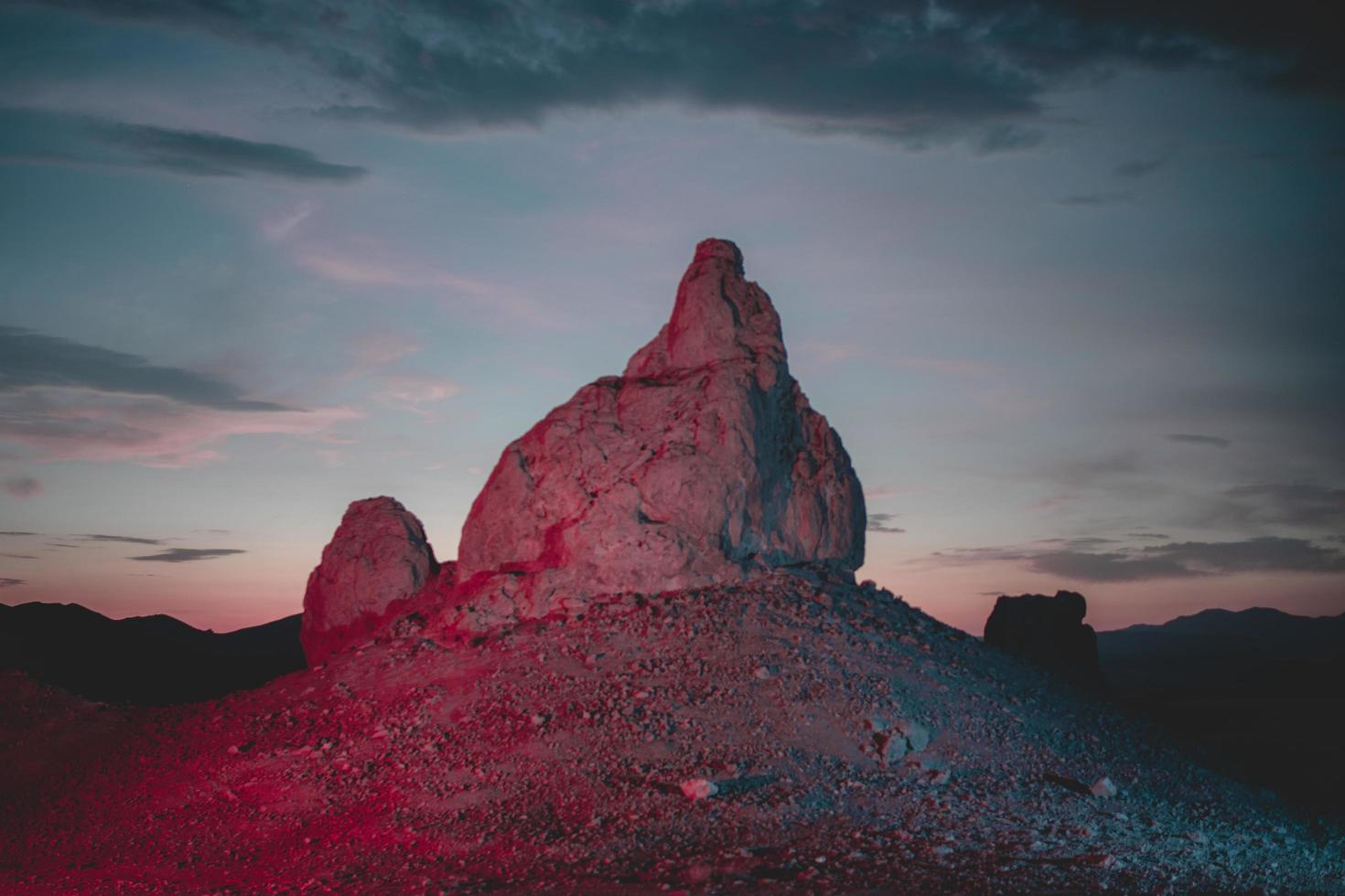 Illuminated desert rock formation photo