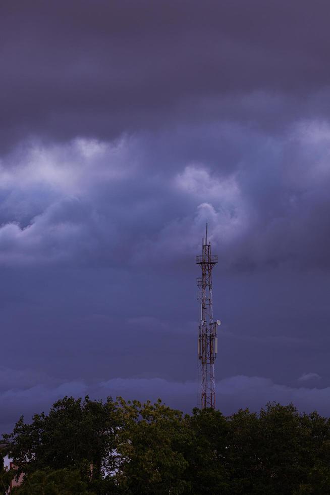 Radio tower against a cloudy sky photo