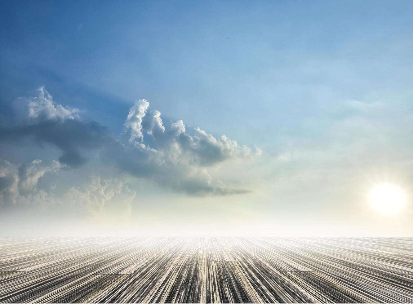 Wooden floor with sky backdrop photo