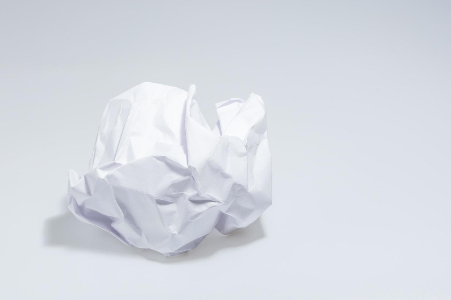 Crumpled paper on white background photo
