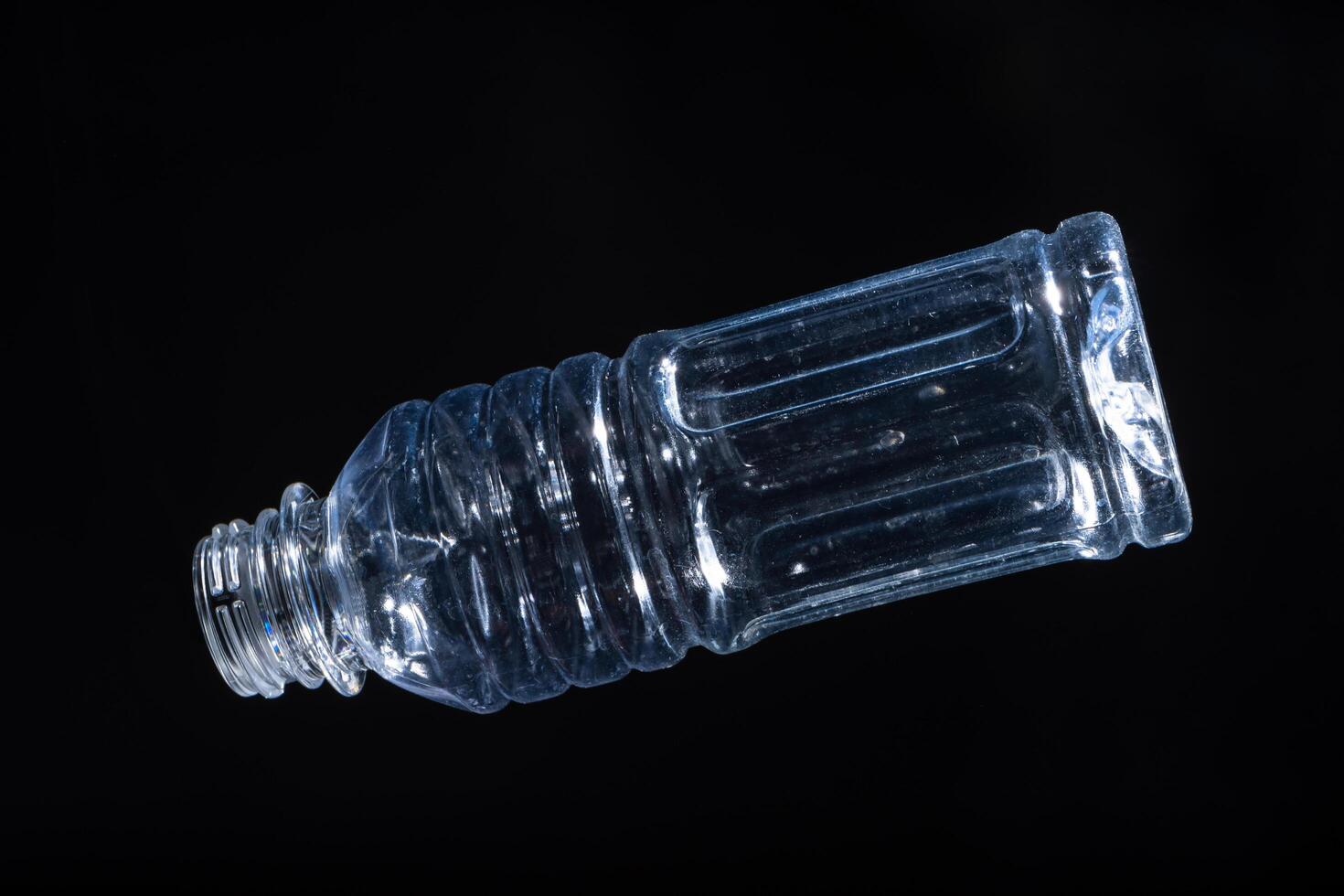 Plastic bottle on black background photo