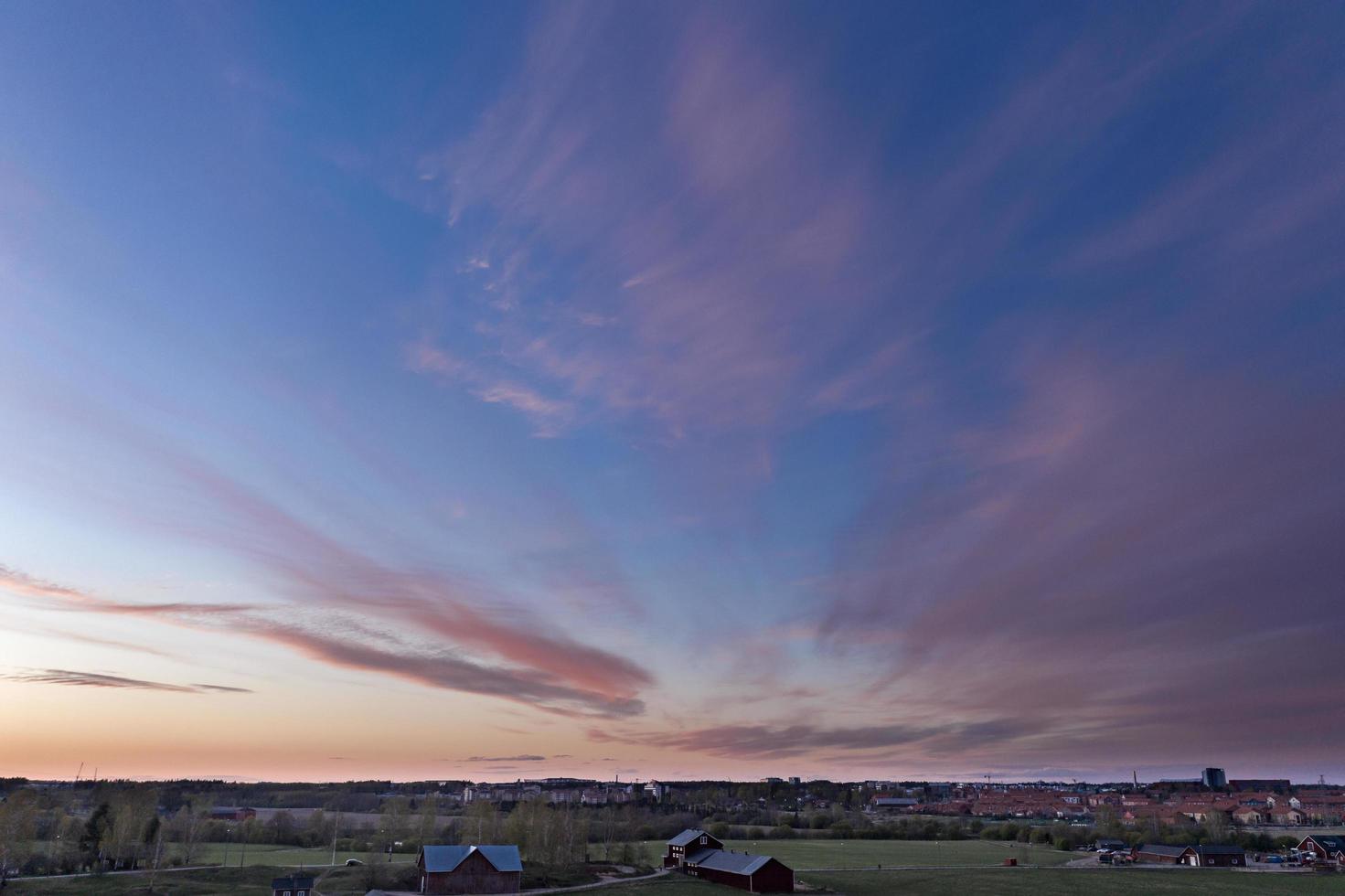 The sky over the city at sunset photo