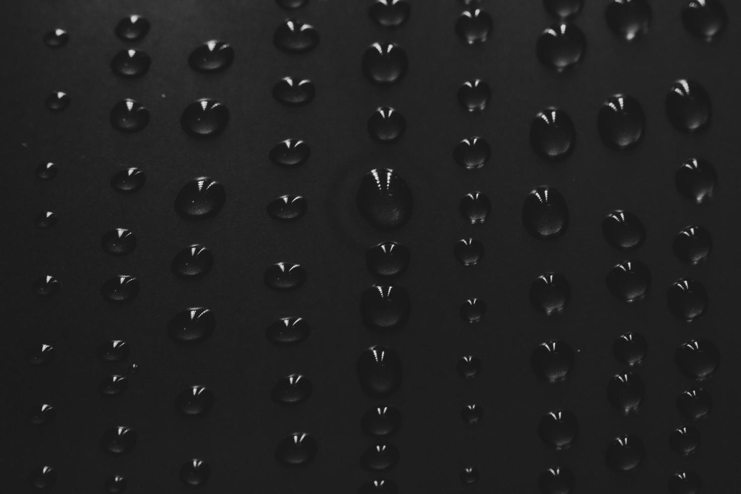 Raindrops on a black background photo