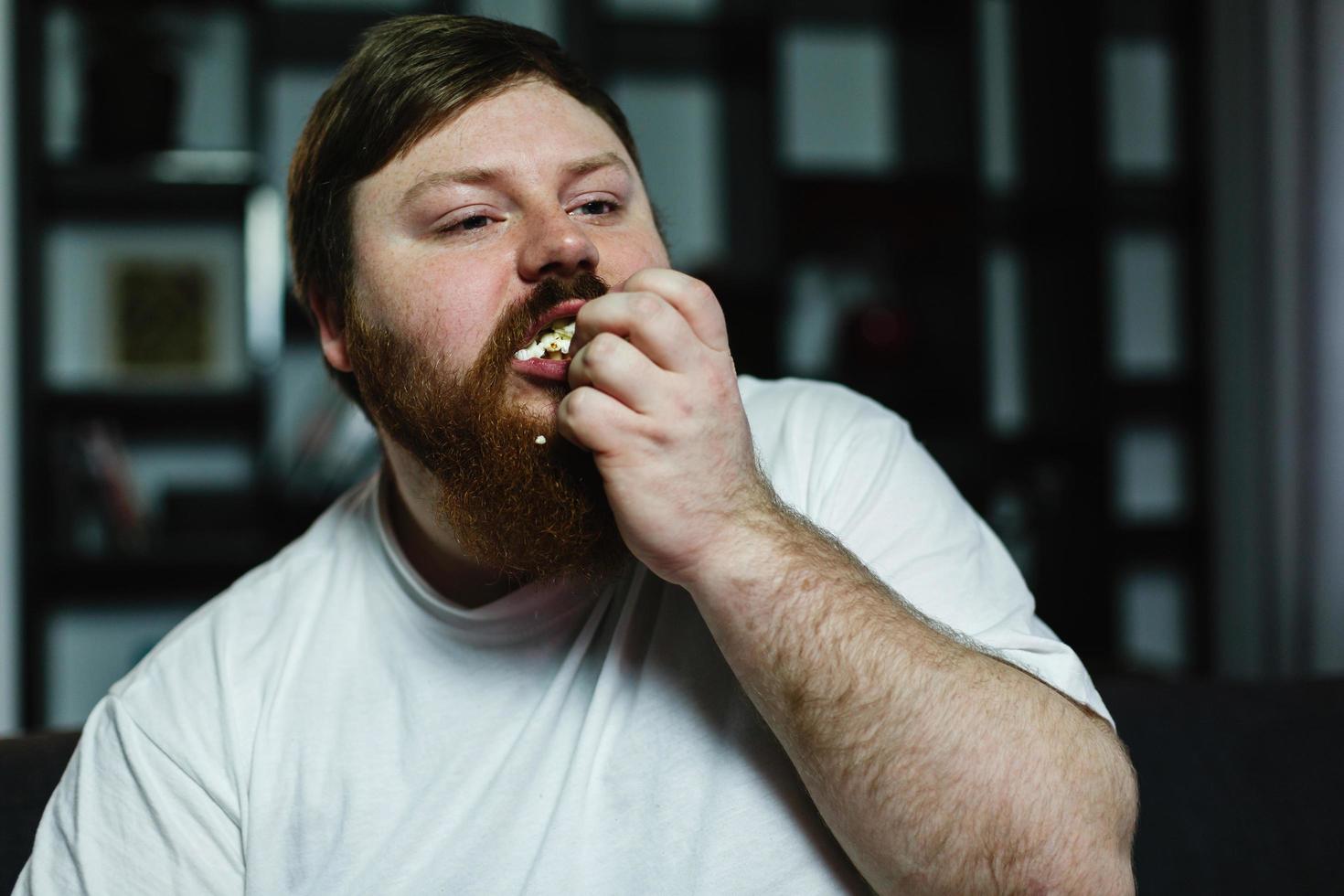 Man stuffing his face photo