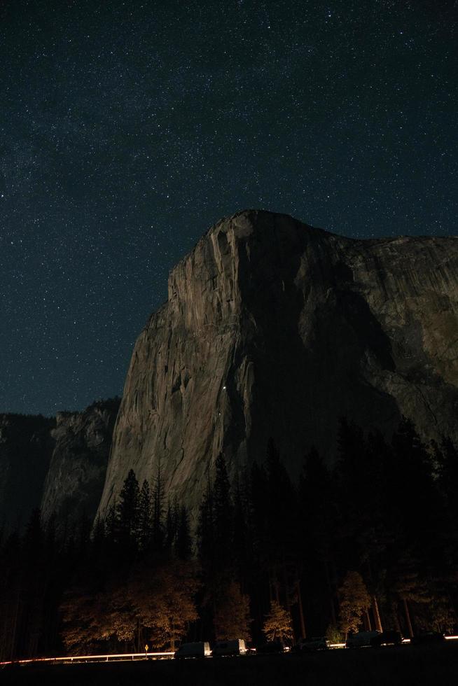 Brown mountain cliff with starry sky photo