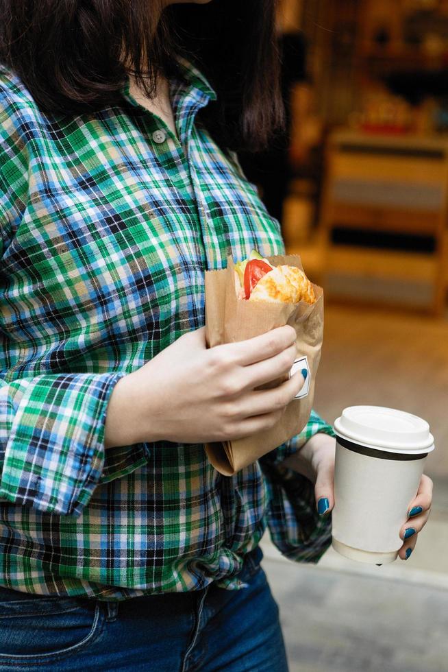 Woman holding sandwich photo