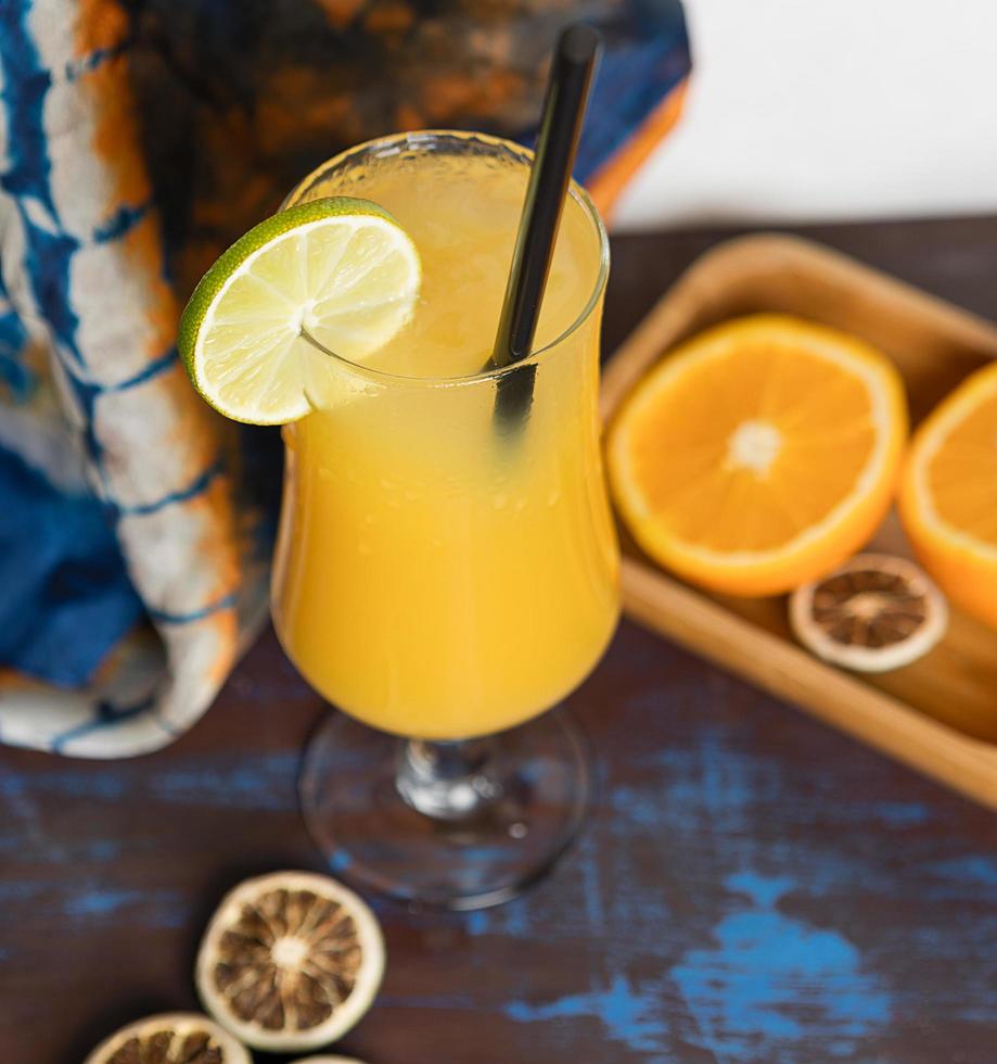 Orange fruit cocktail with lemon photo