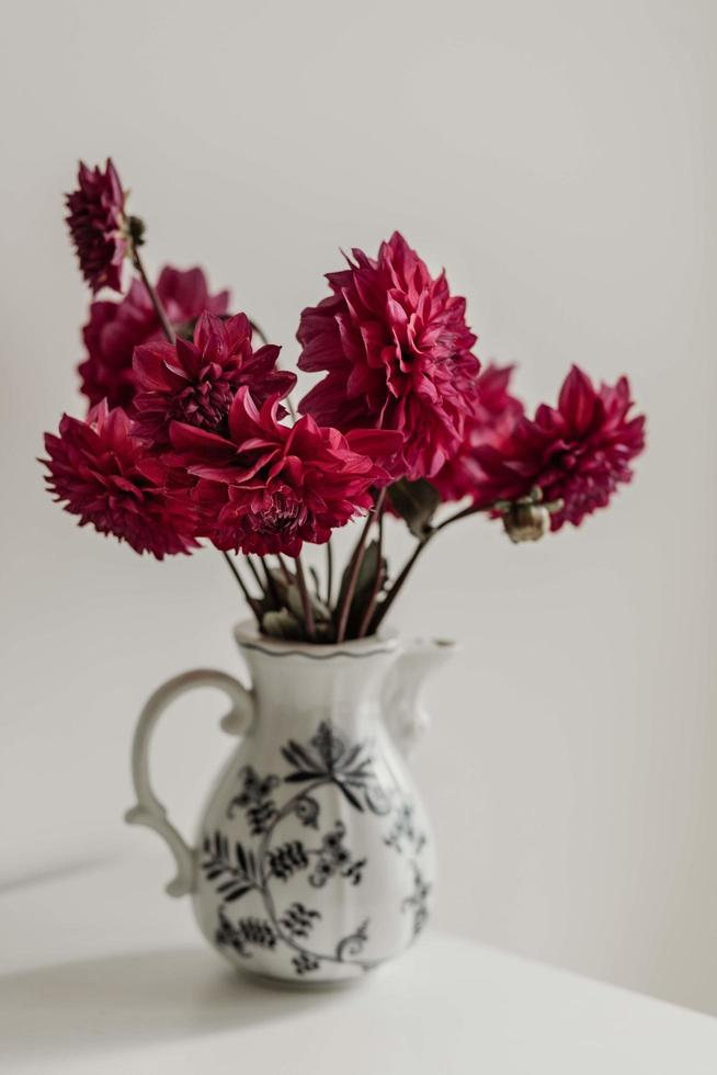 Red dahlias in a vase photo