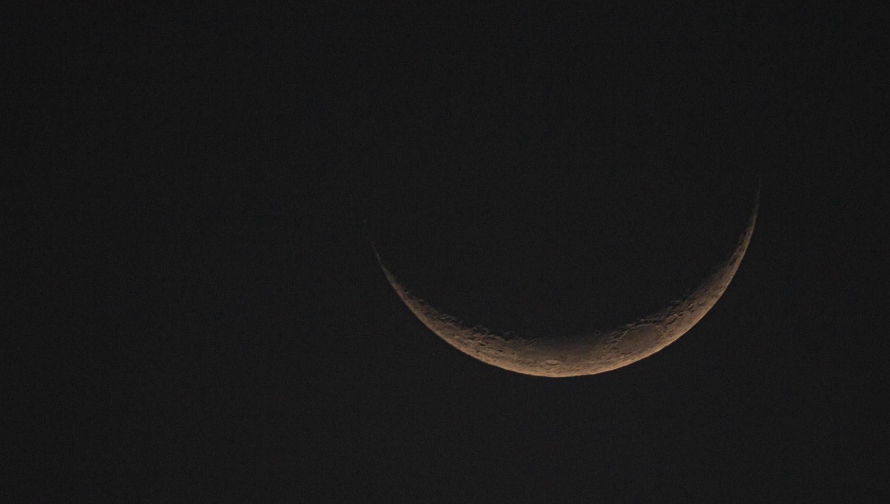 A view of a crescent moon photo