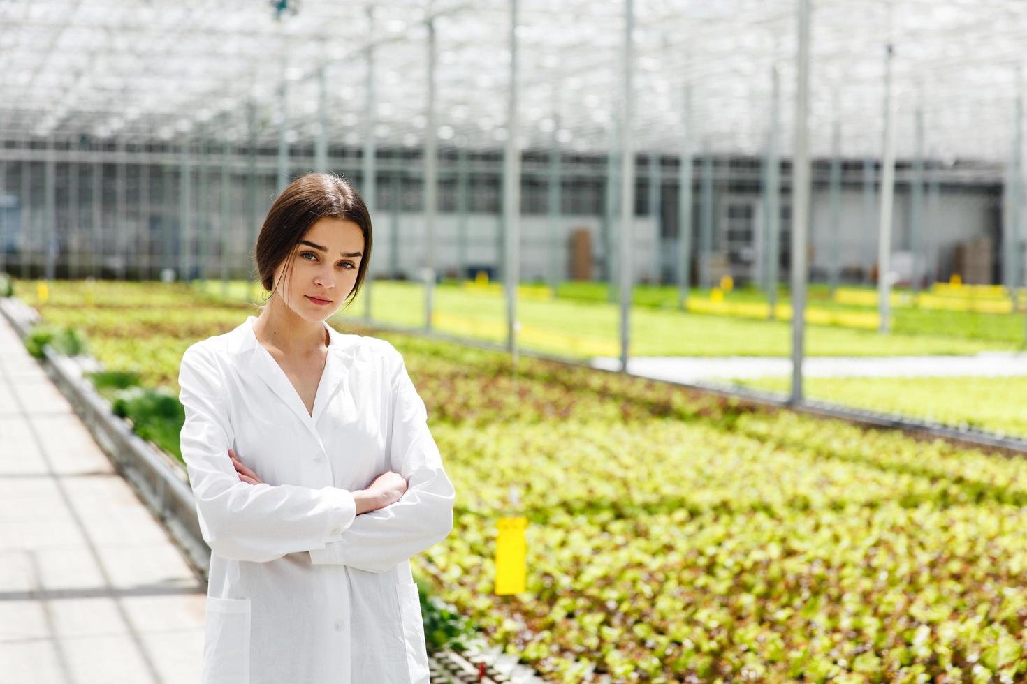 Woman in white laboratory robe photo