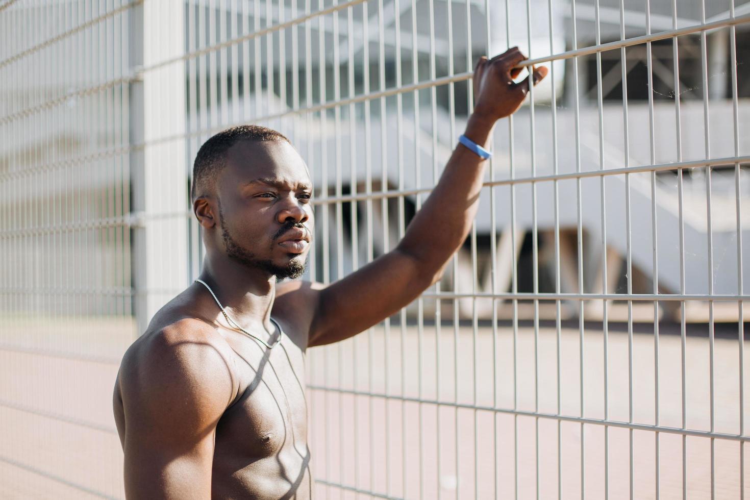 Man holding the fence photo