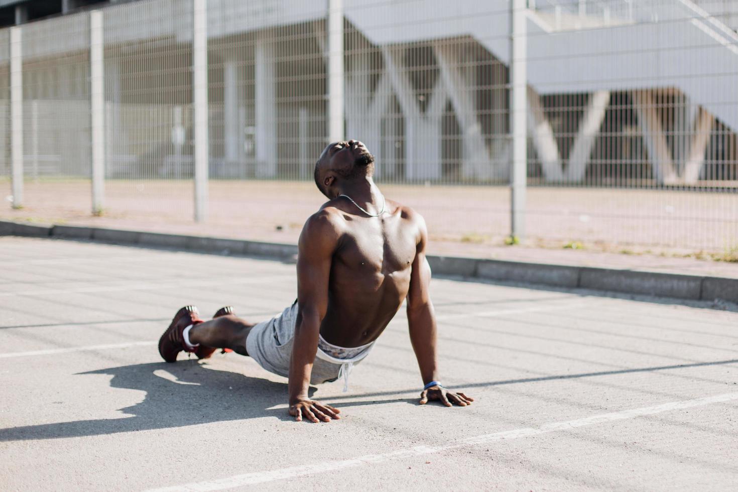 Man stretching in a yoga pose photo