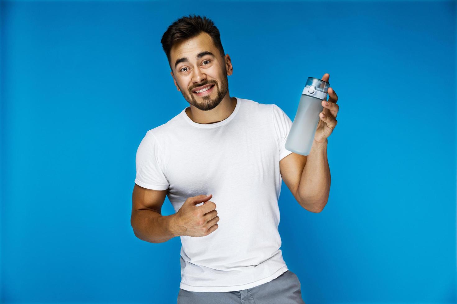 Funny boy shows a bottle photo