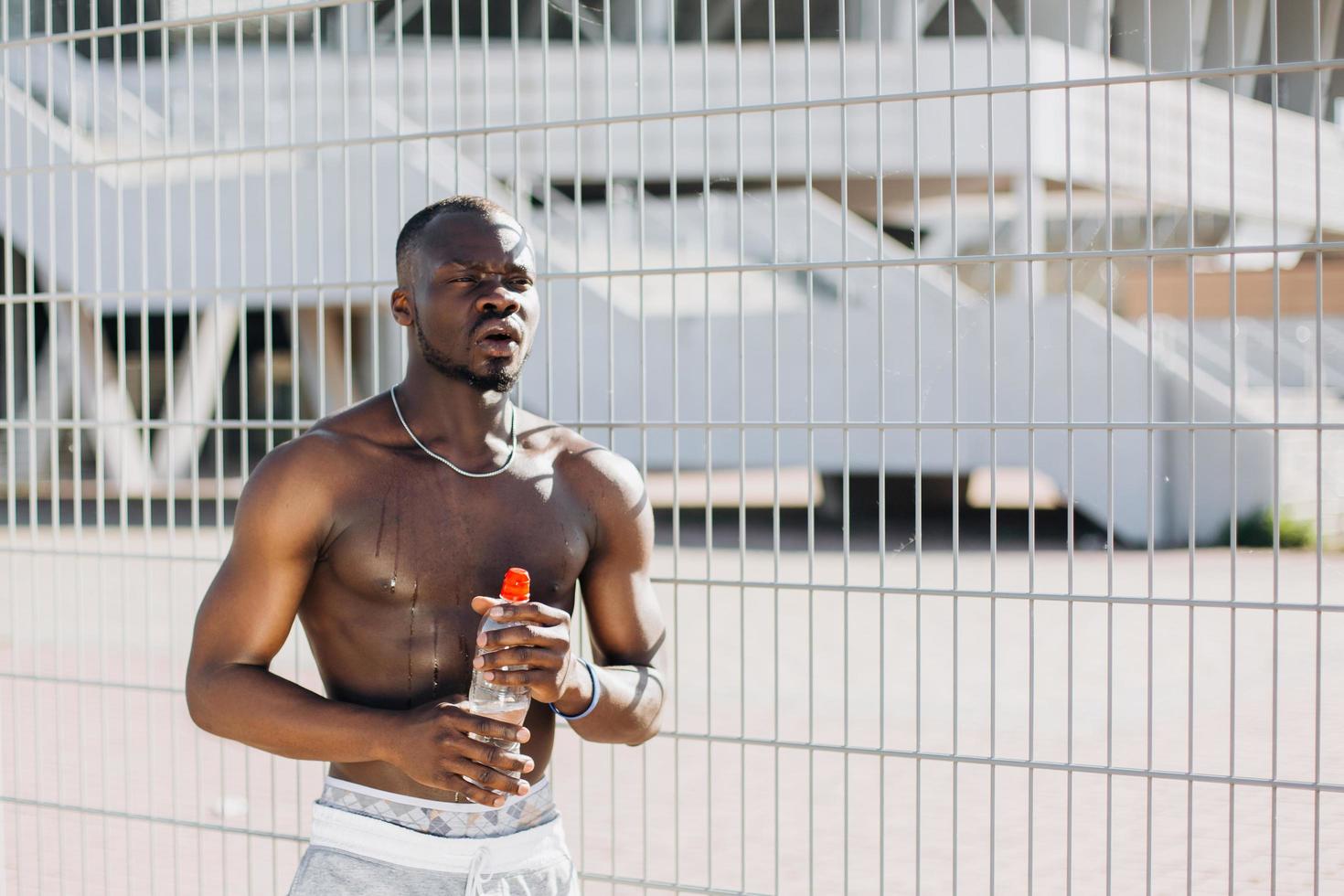 Man holding a water bottle photo