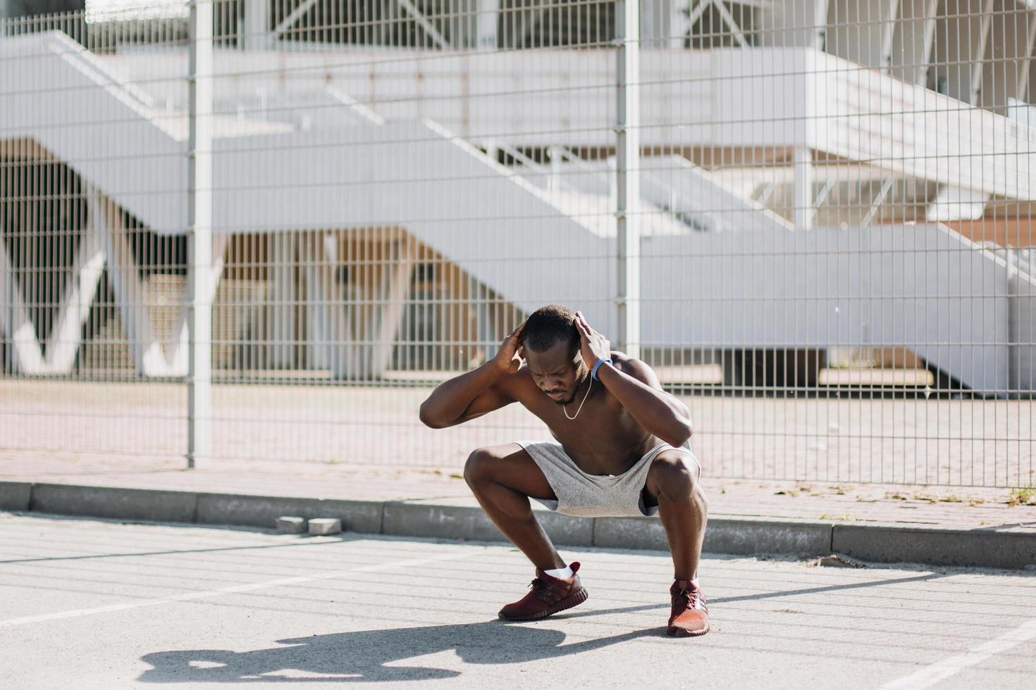 Man doing squats photo