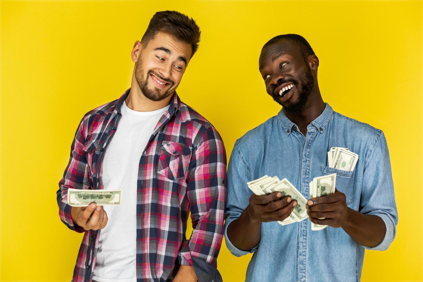 Two men holding money photo