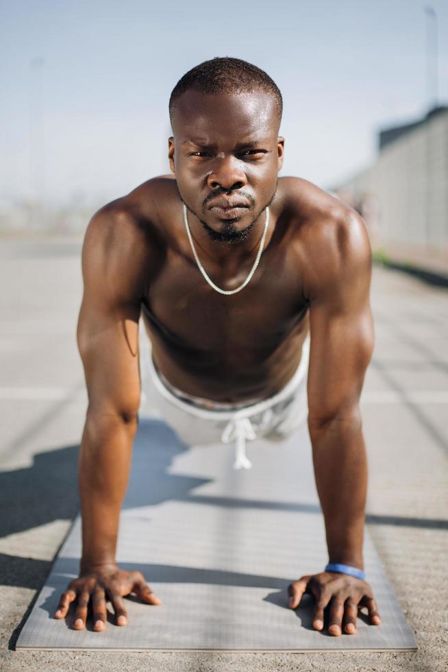 Athlete doing push ups photo