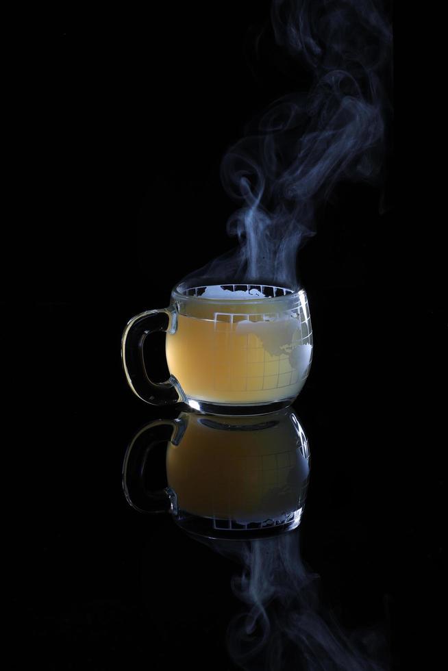 Glass mug with hot liquid photo