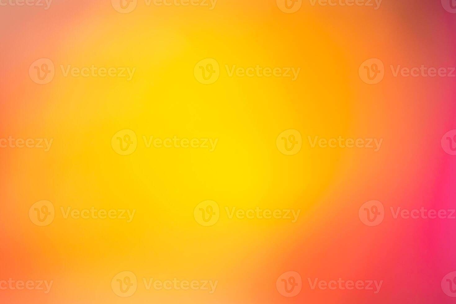 A blurry image of a yellow and orange light photo