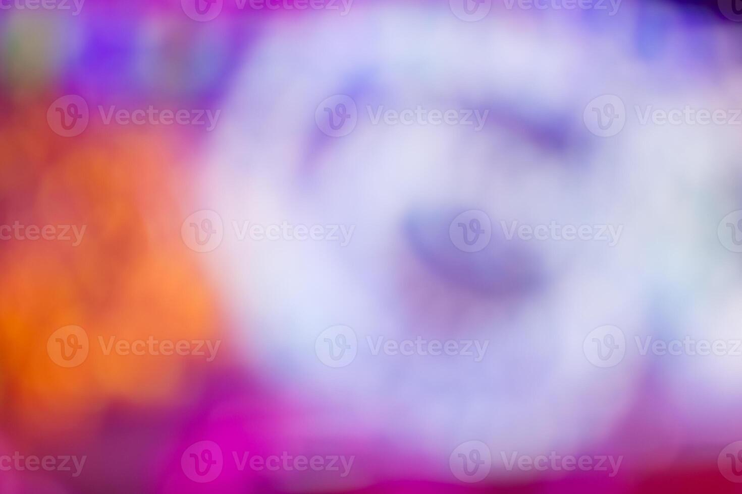 A blurry image of a colorful light show photo