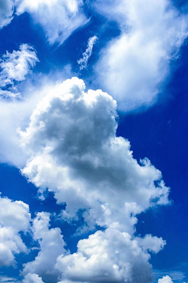 Tall blue sky with clouds photo