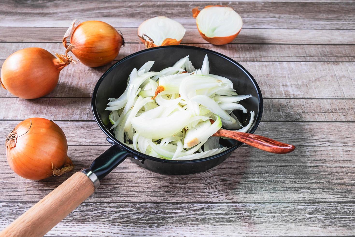 Chopped onions in a frying pan photo