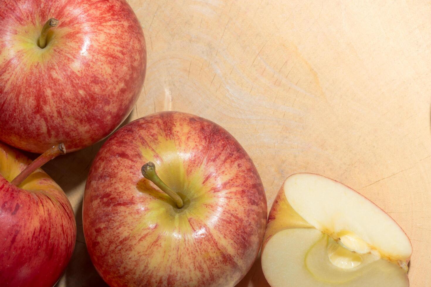 Apples on a wooden floor photo