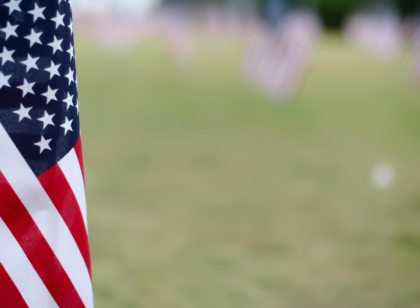 Close-up of an American flag in a field photo