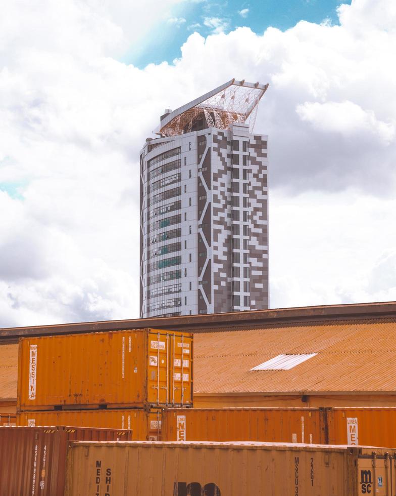 Kampala, Uganda, 2020 - Freight containers in front of a high-rise building photo