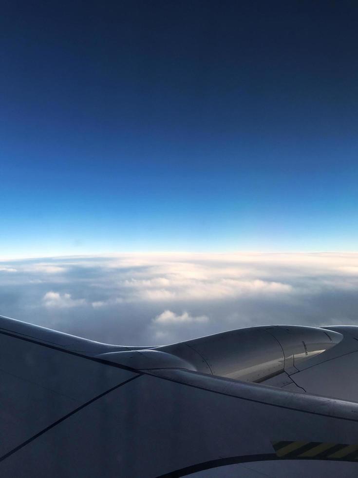 View of a blue sky and clouds from an airplane photo