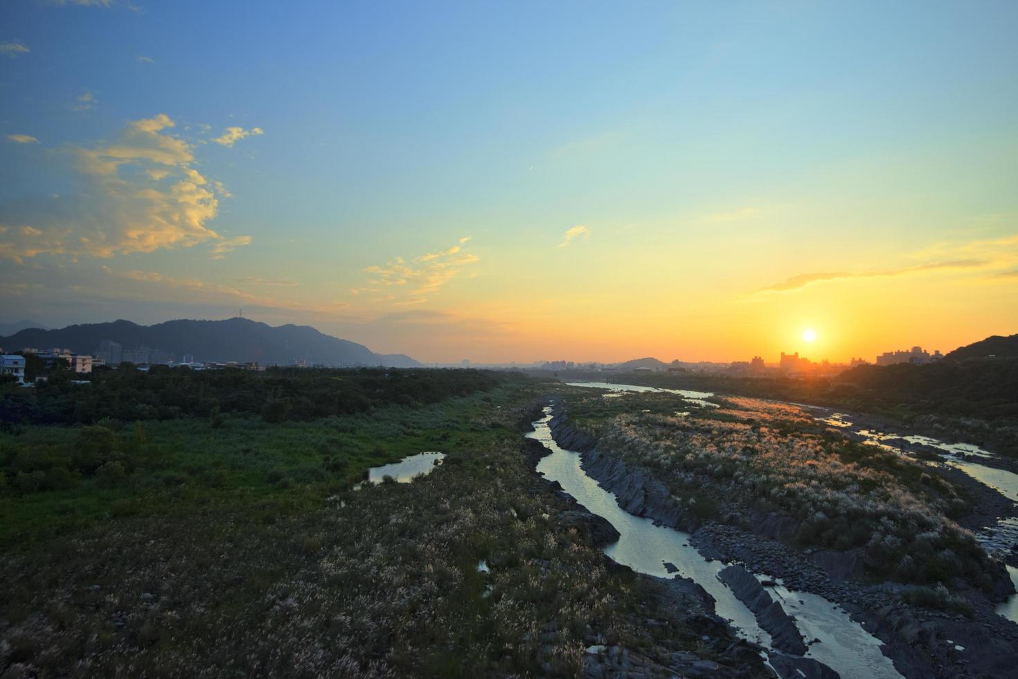 Aerial view of a stream at sunset photo