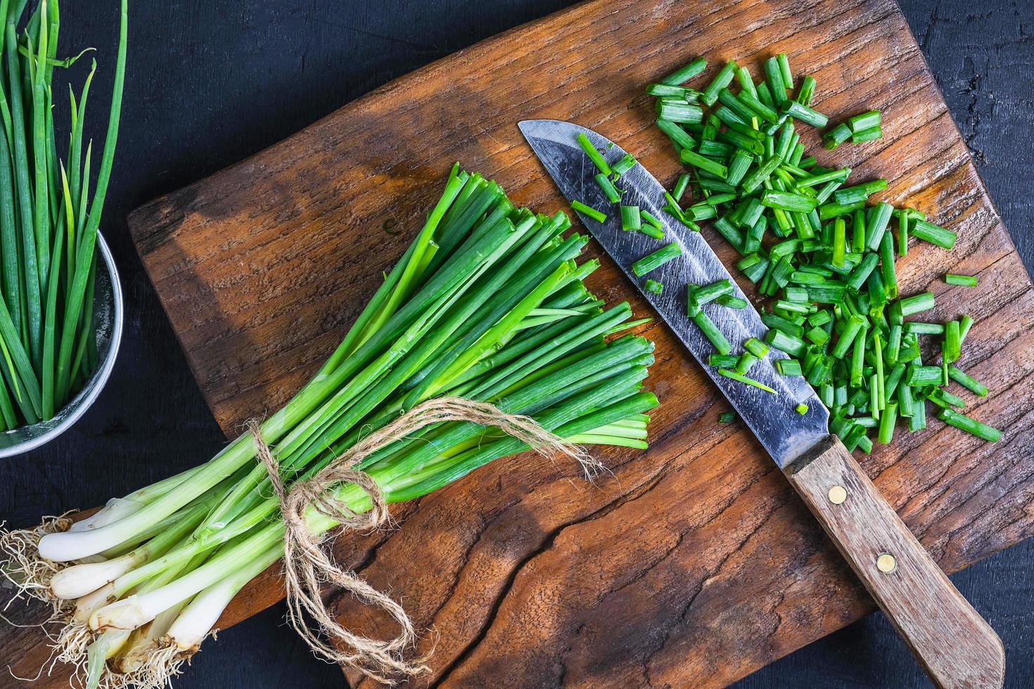 Fresh onion cut on wooden chopping board photo