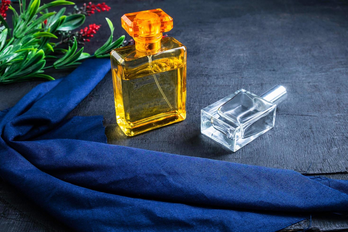 Perfume in gold and clear bottles photo