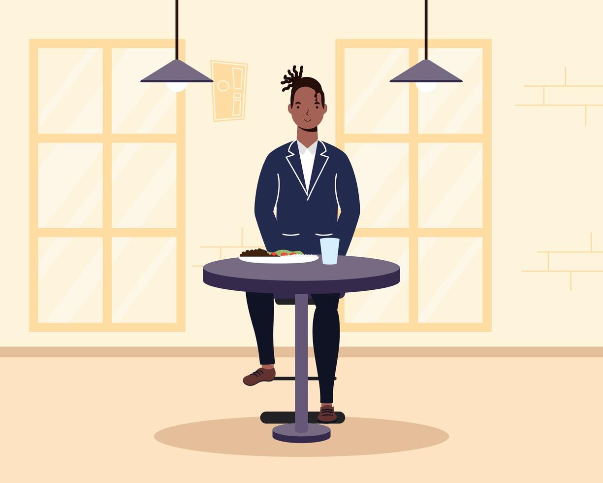 Young man seated in a restaurant vector