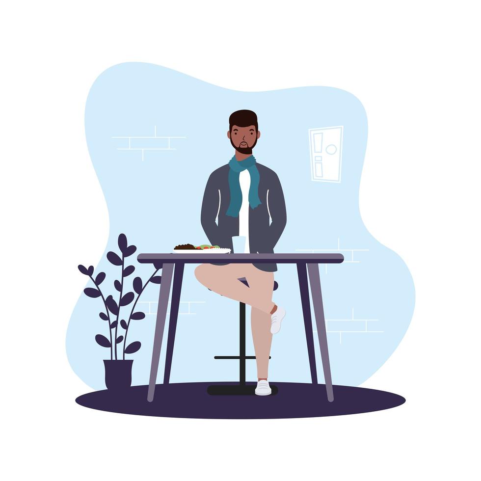 Young man seated in a restaurant vector