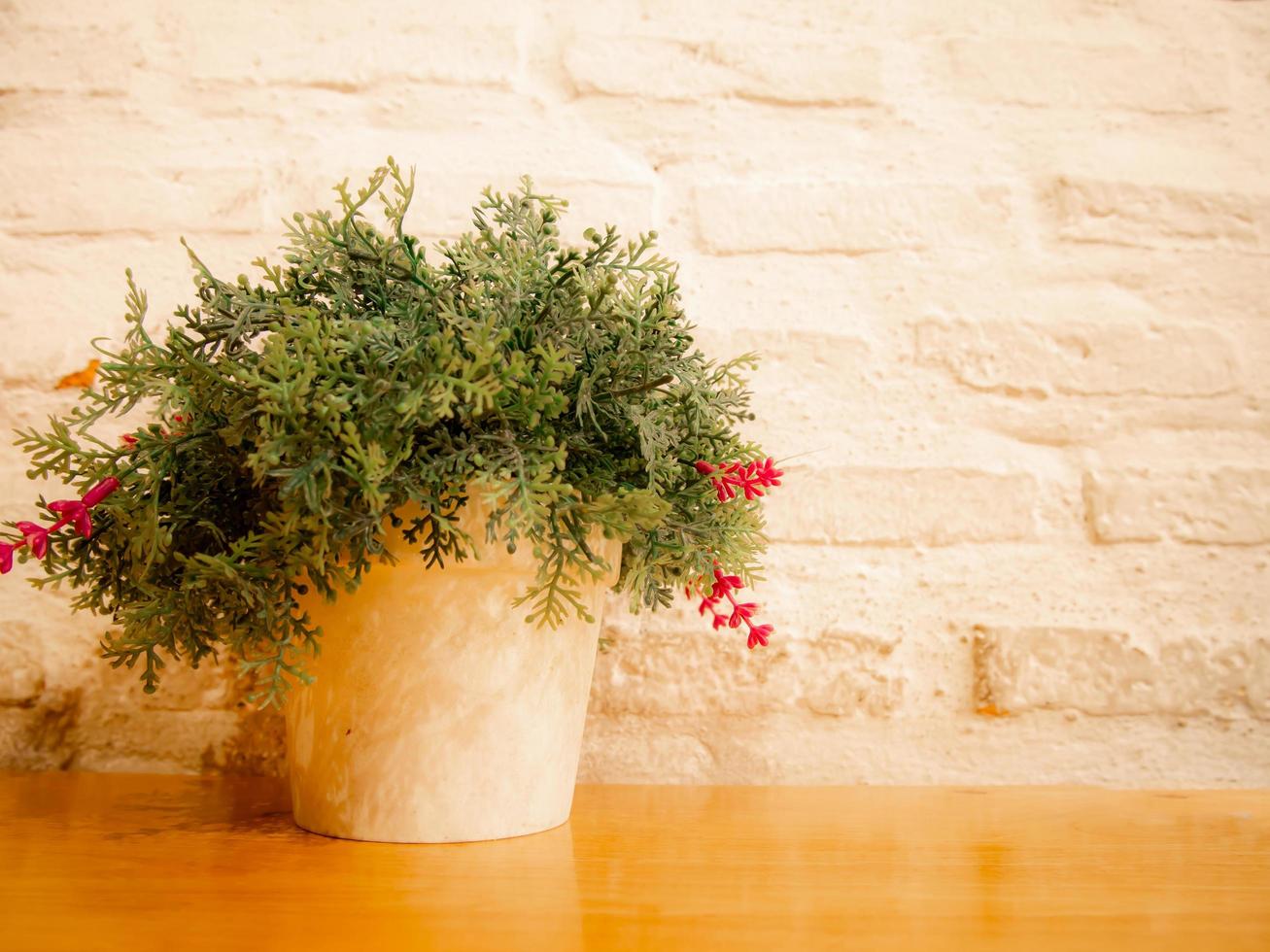 Flower In Pot On Wooden Table White Brick Wall Background Stock Photo At Vecteezy